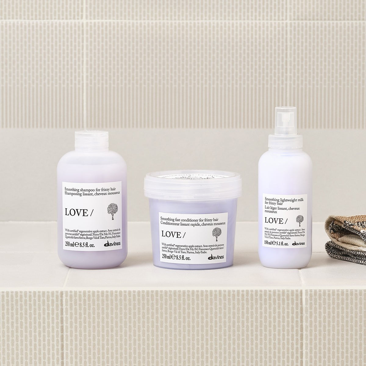 Davines LOVE Smoothing Shampoo with the LOVE Smoothing range on a bathroom shelf